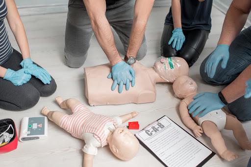 group class of practicing CPR