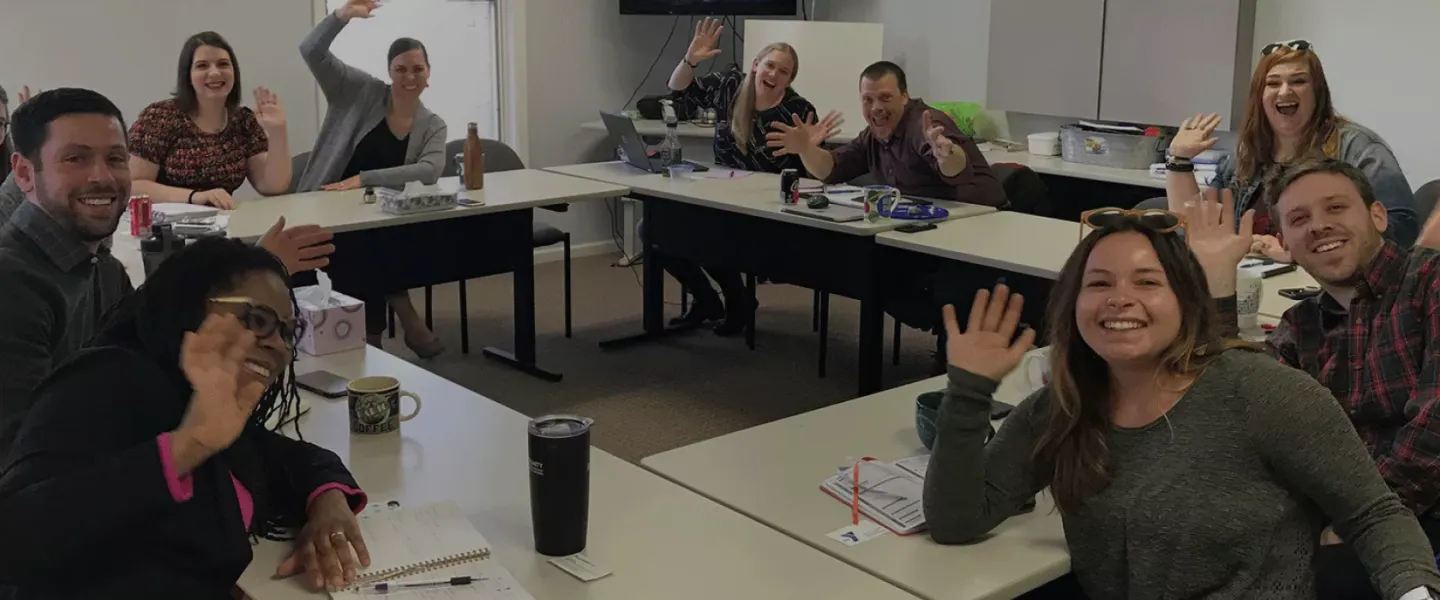 YMCA Alliance Staff Members waving at camera