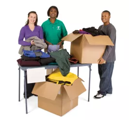 YMCA employees sorting boxes of clothing