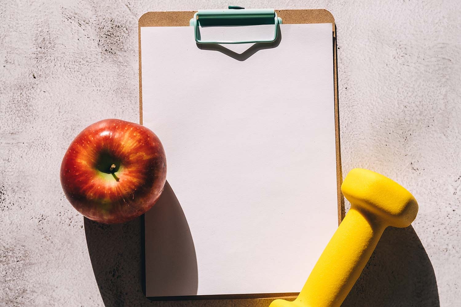 Image of apple clipboard and weight