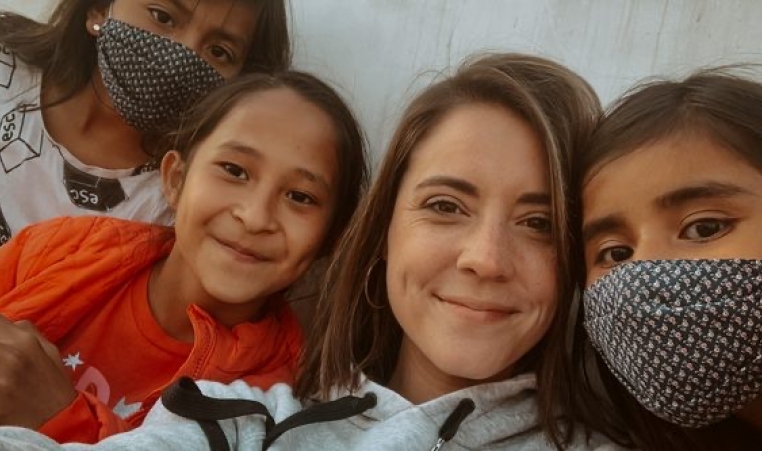 Missionary woman with children smiling