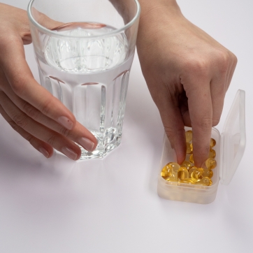 Woman taking vitamin