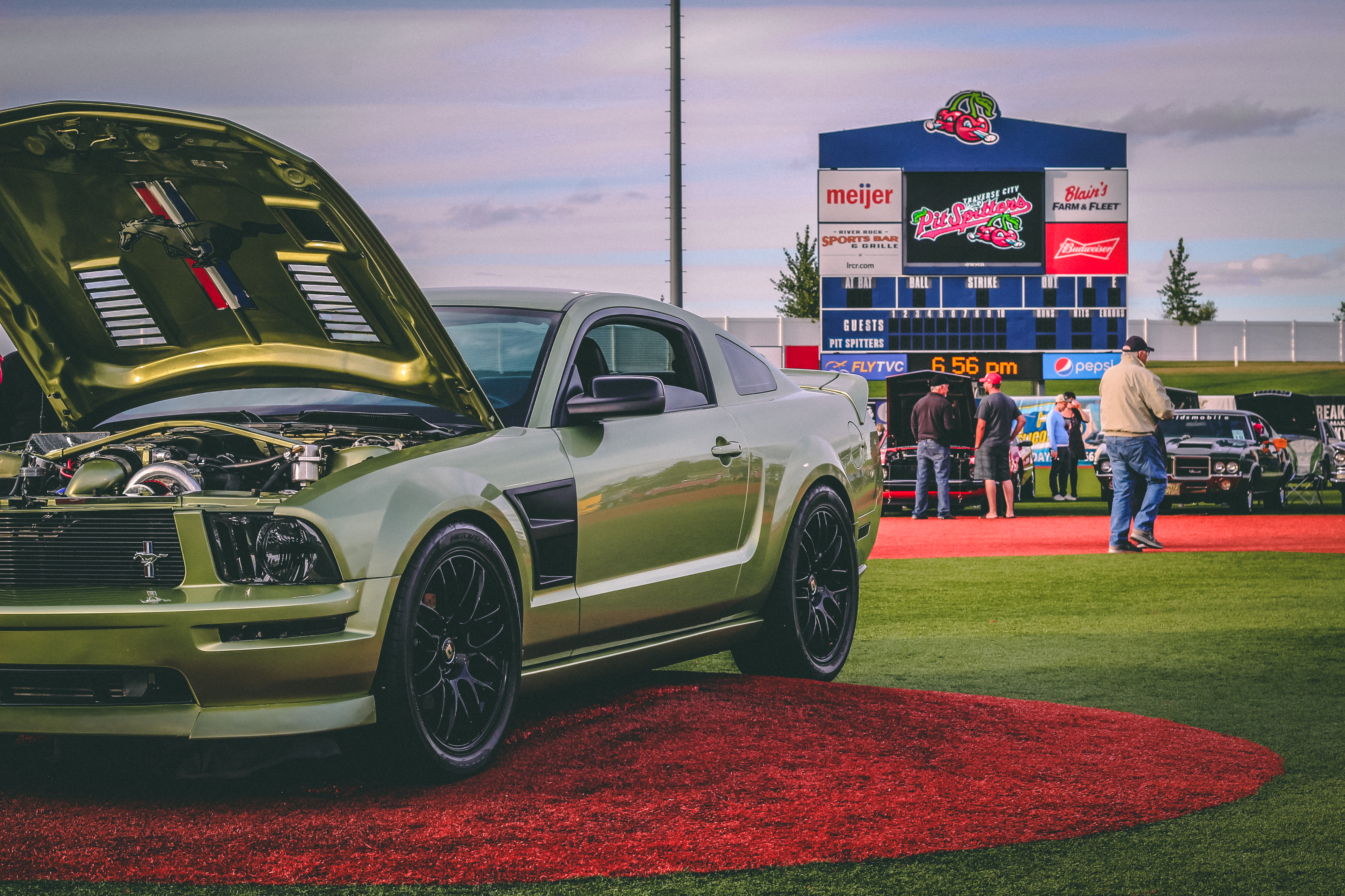 Classic cars on a baseball diamond