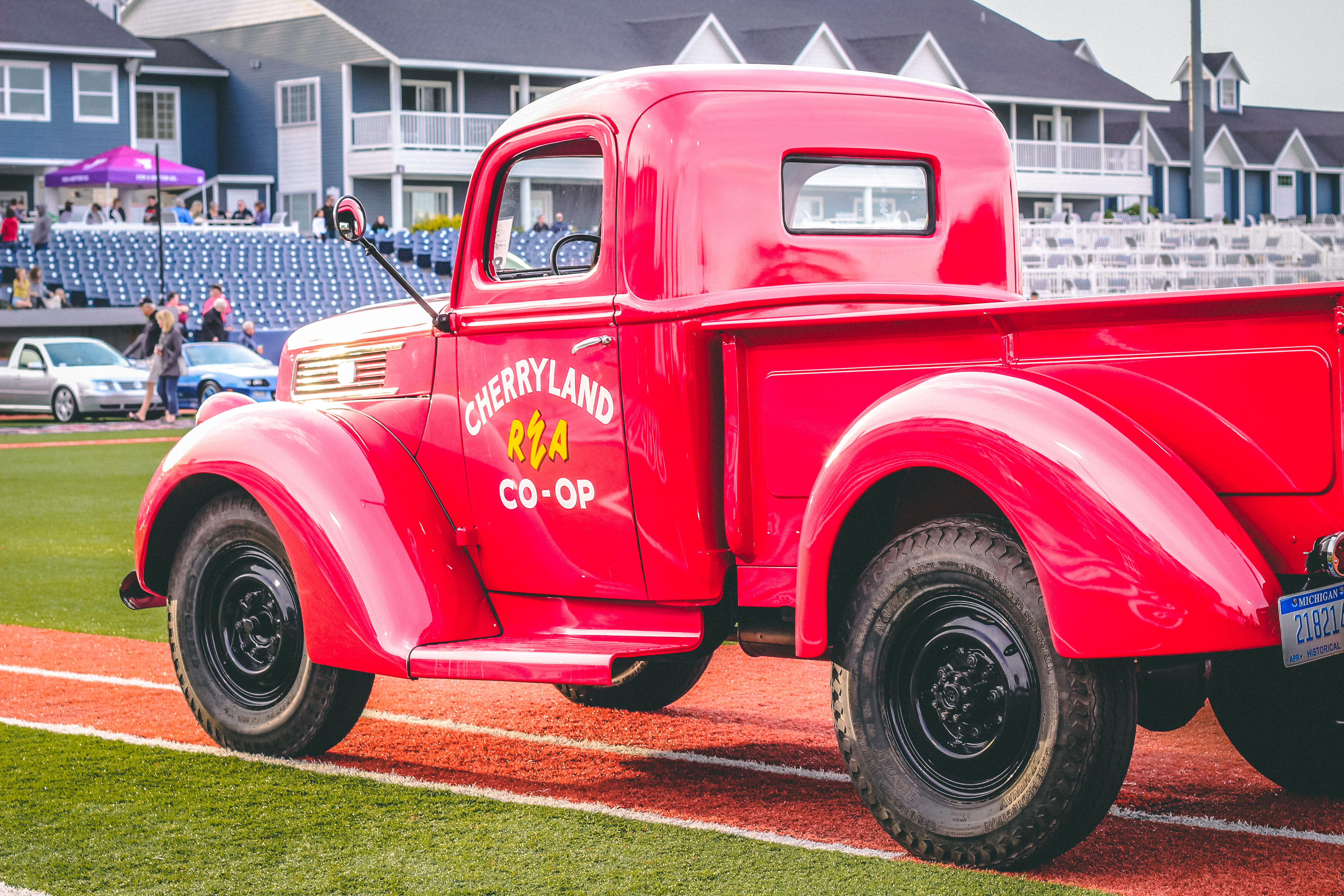 Classic cars on a baseball diamond