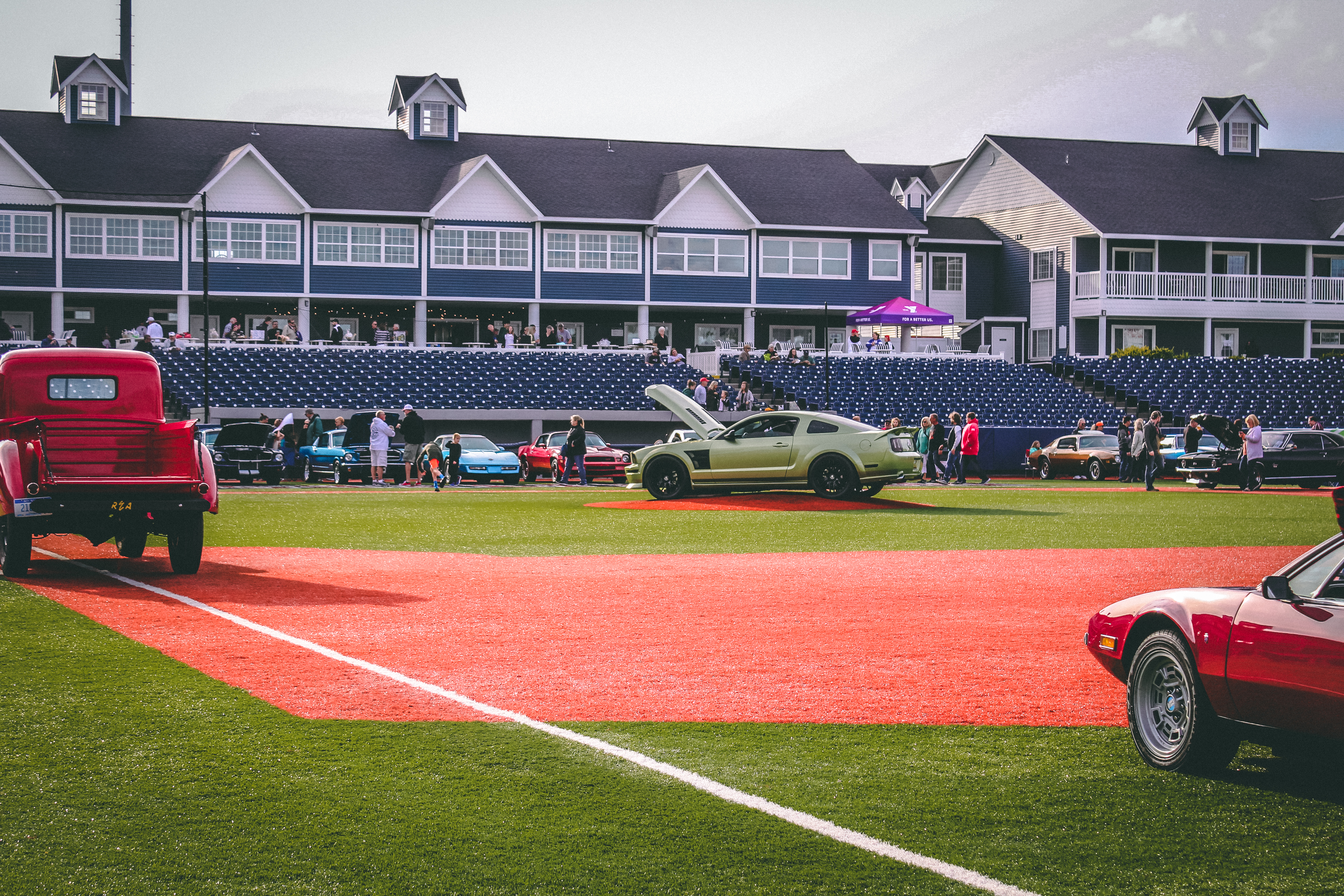 Classic cars on a baseball diamond