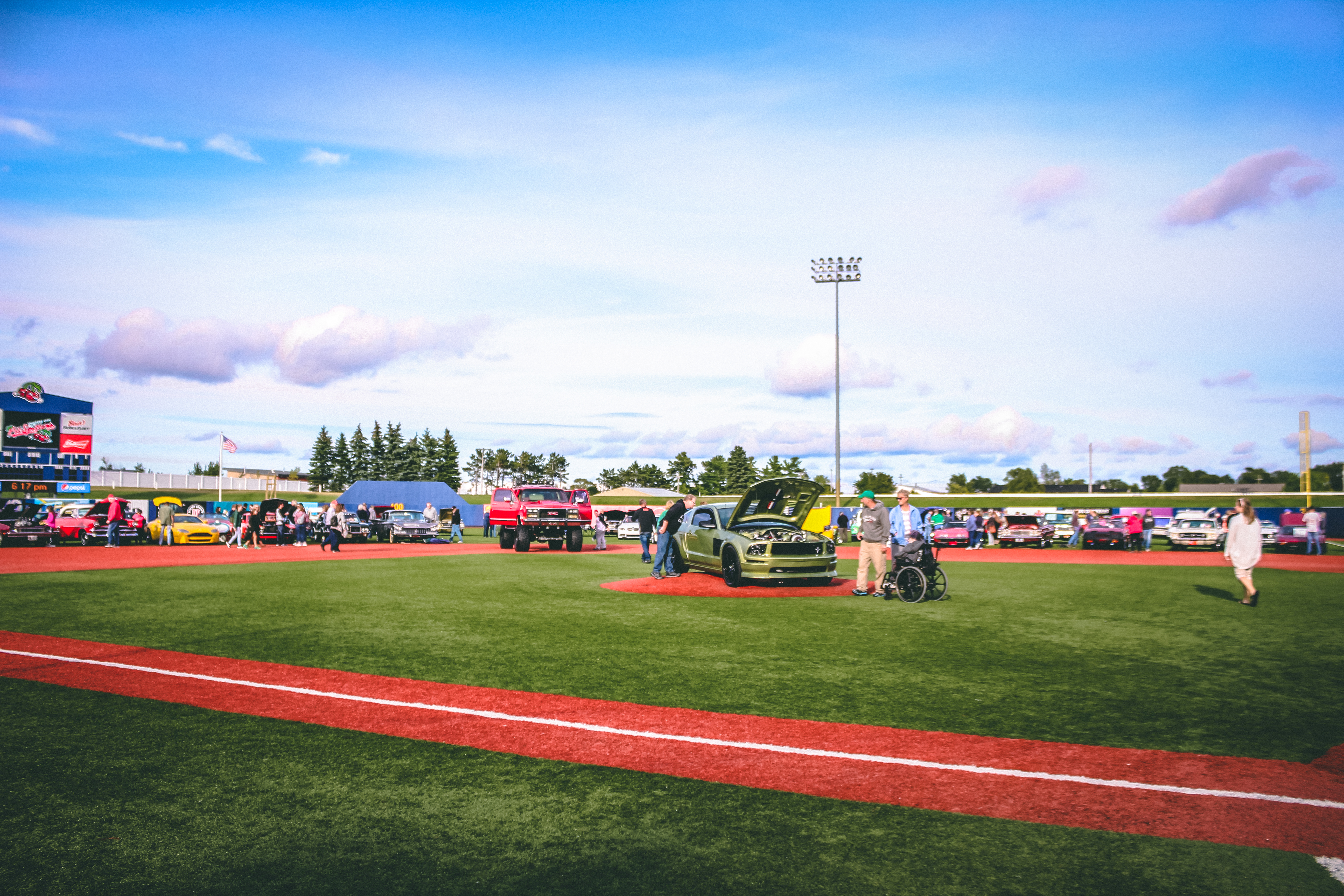 Classic cars on a baseball diamond