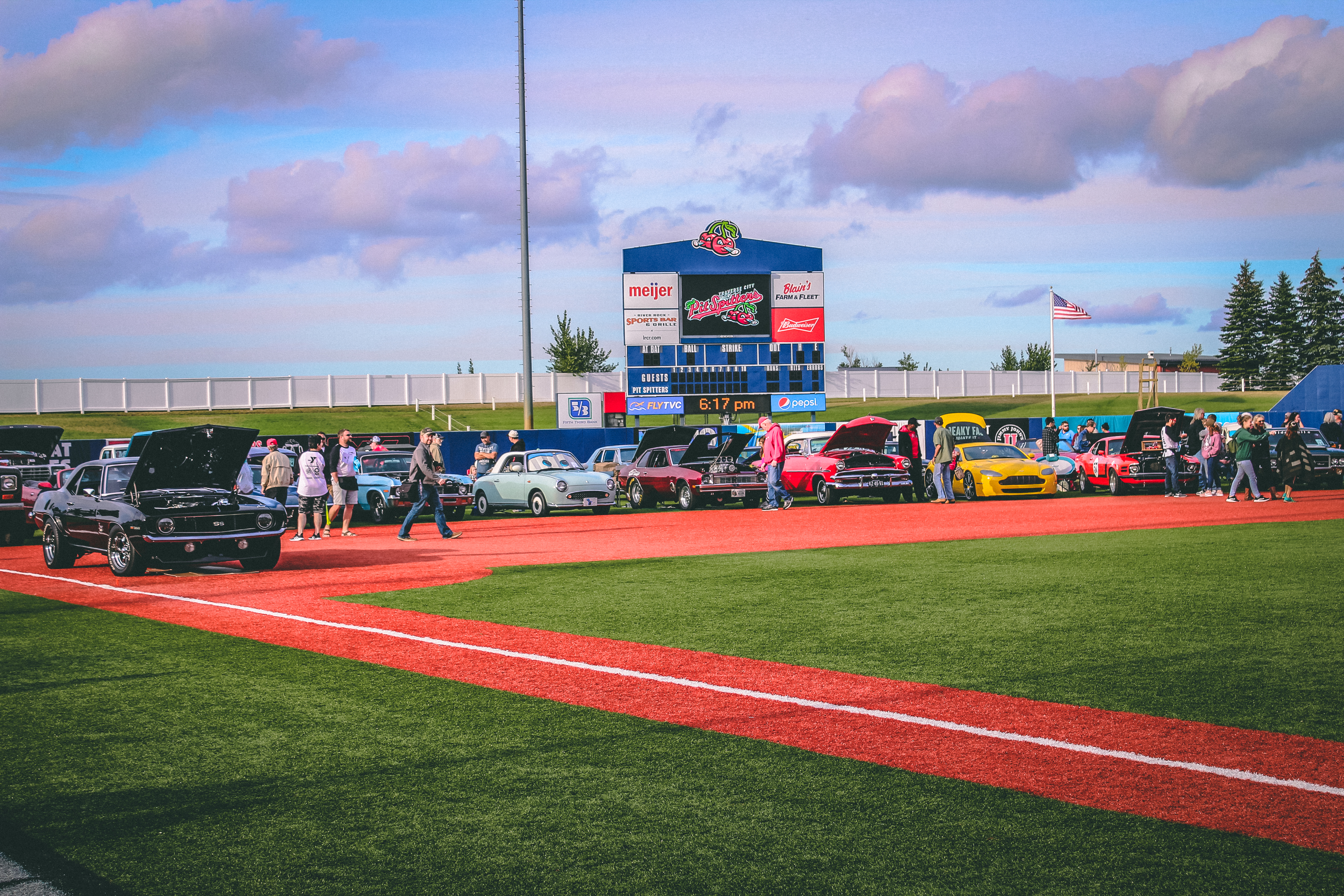 Classic cars on a baseball diamond