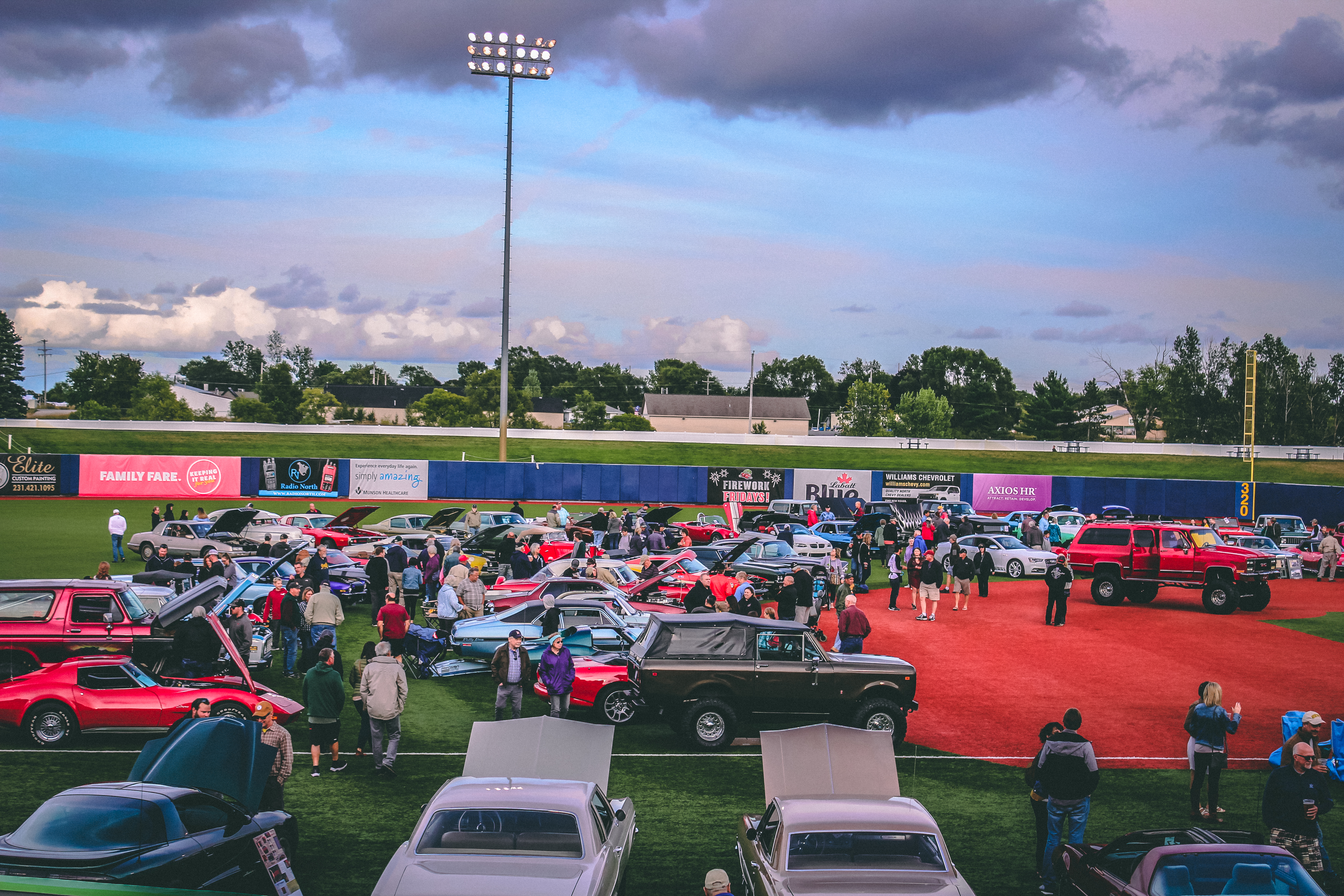 Classic cars on a baseball diamond