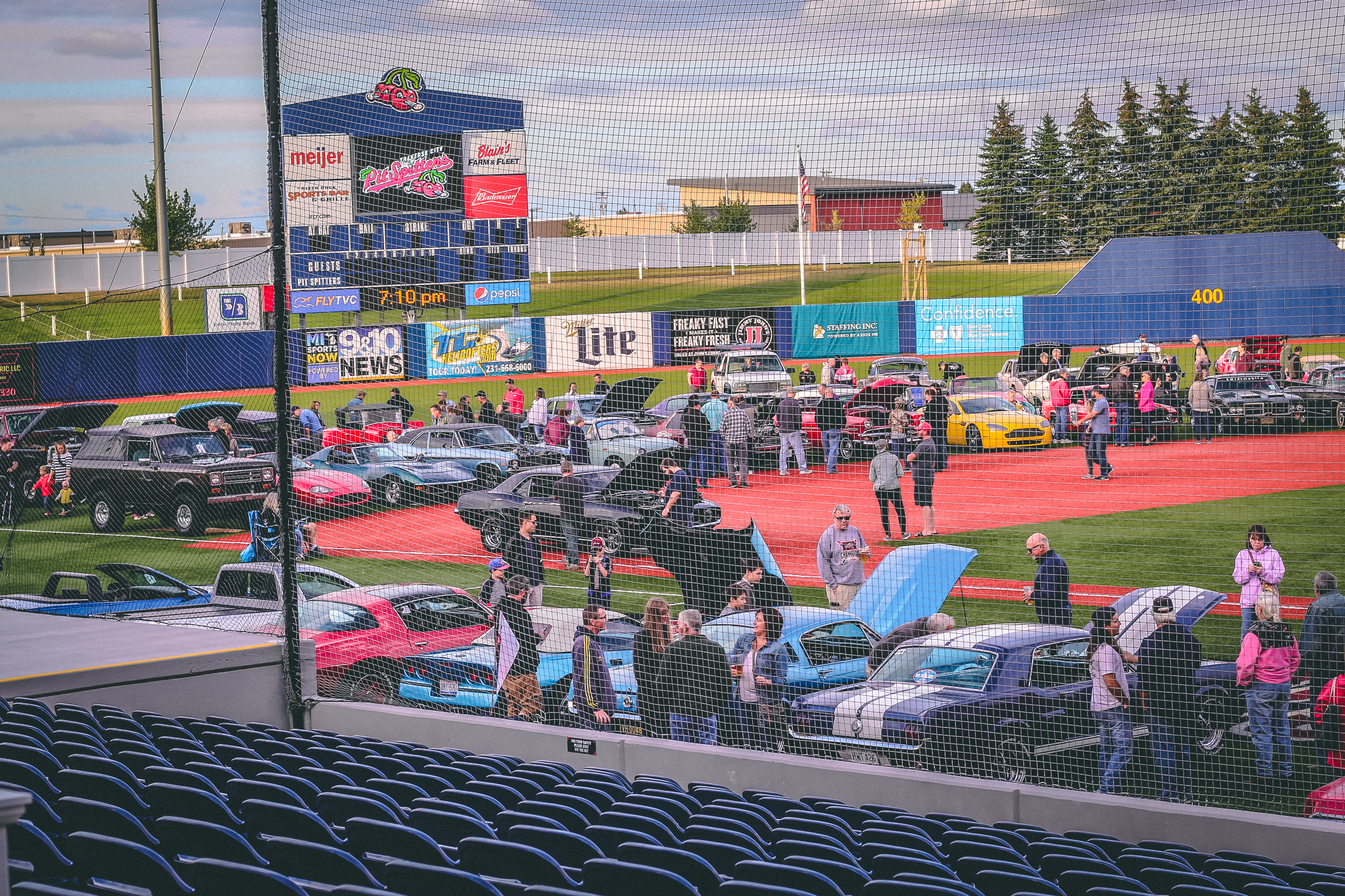 Classic cars on a baseball diamond