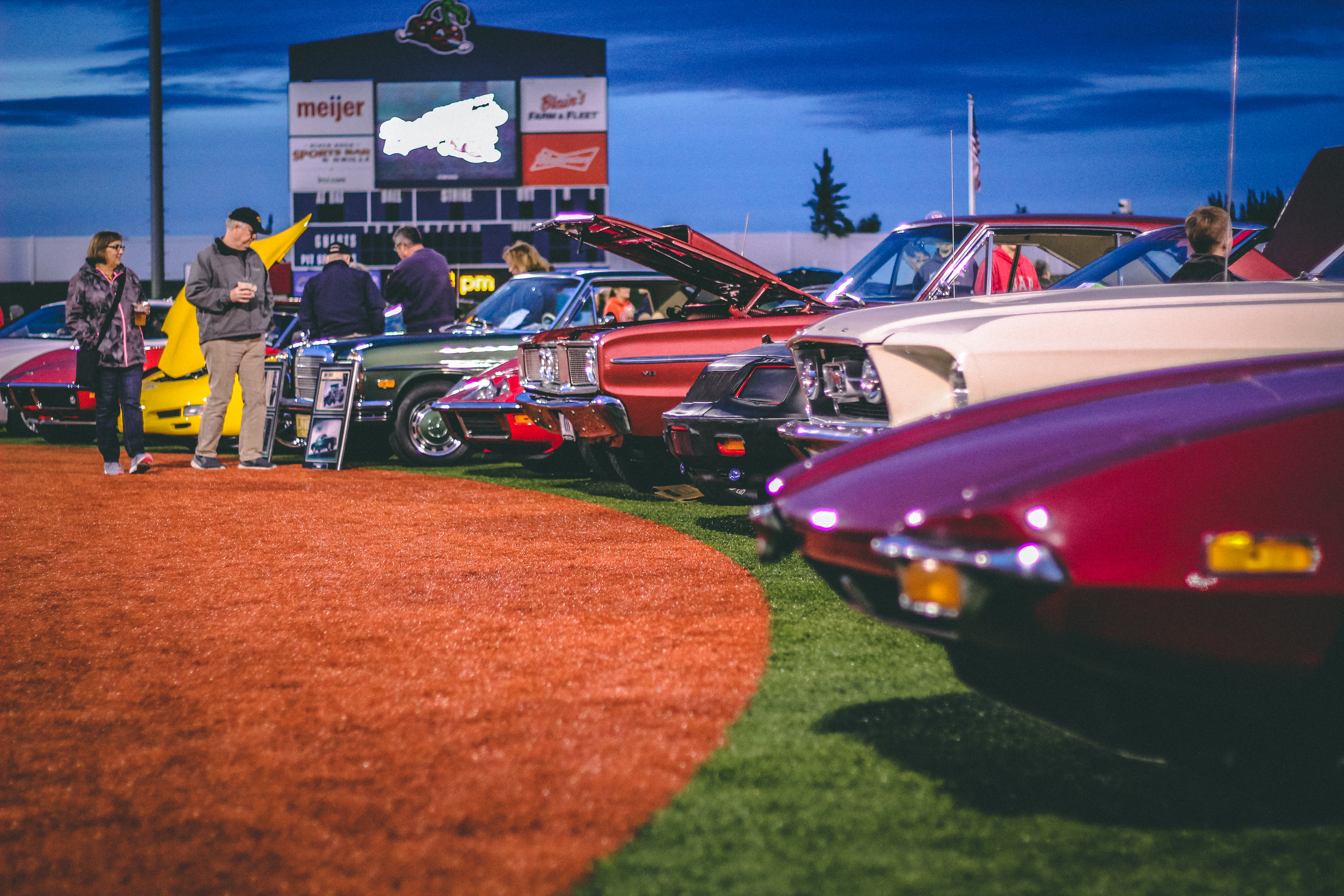 Classic cars on a baseball diamond