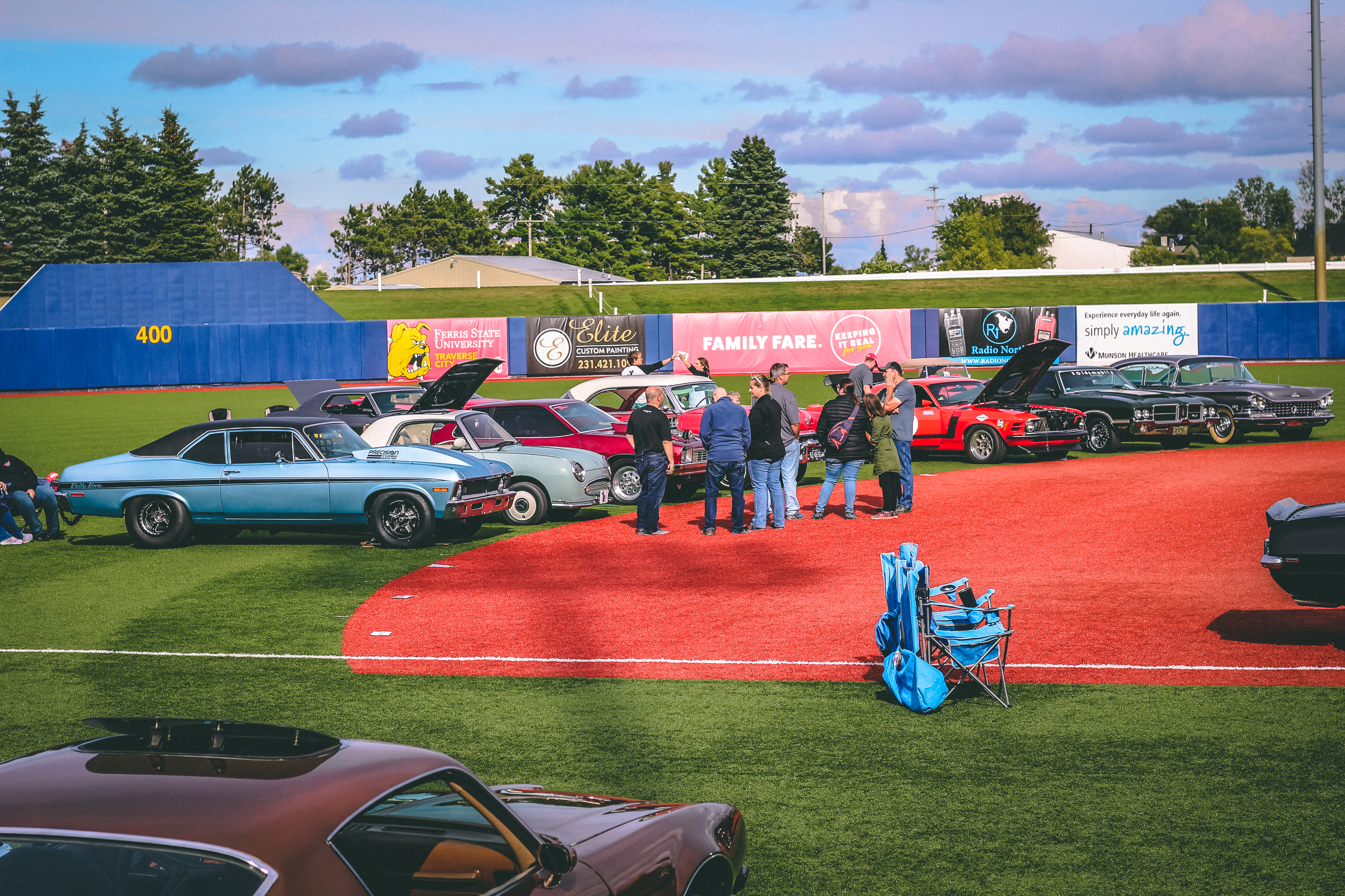 Classic cars on a baseball diamond