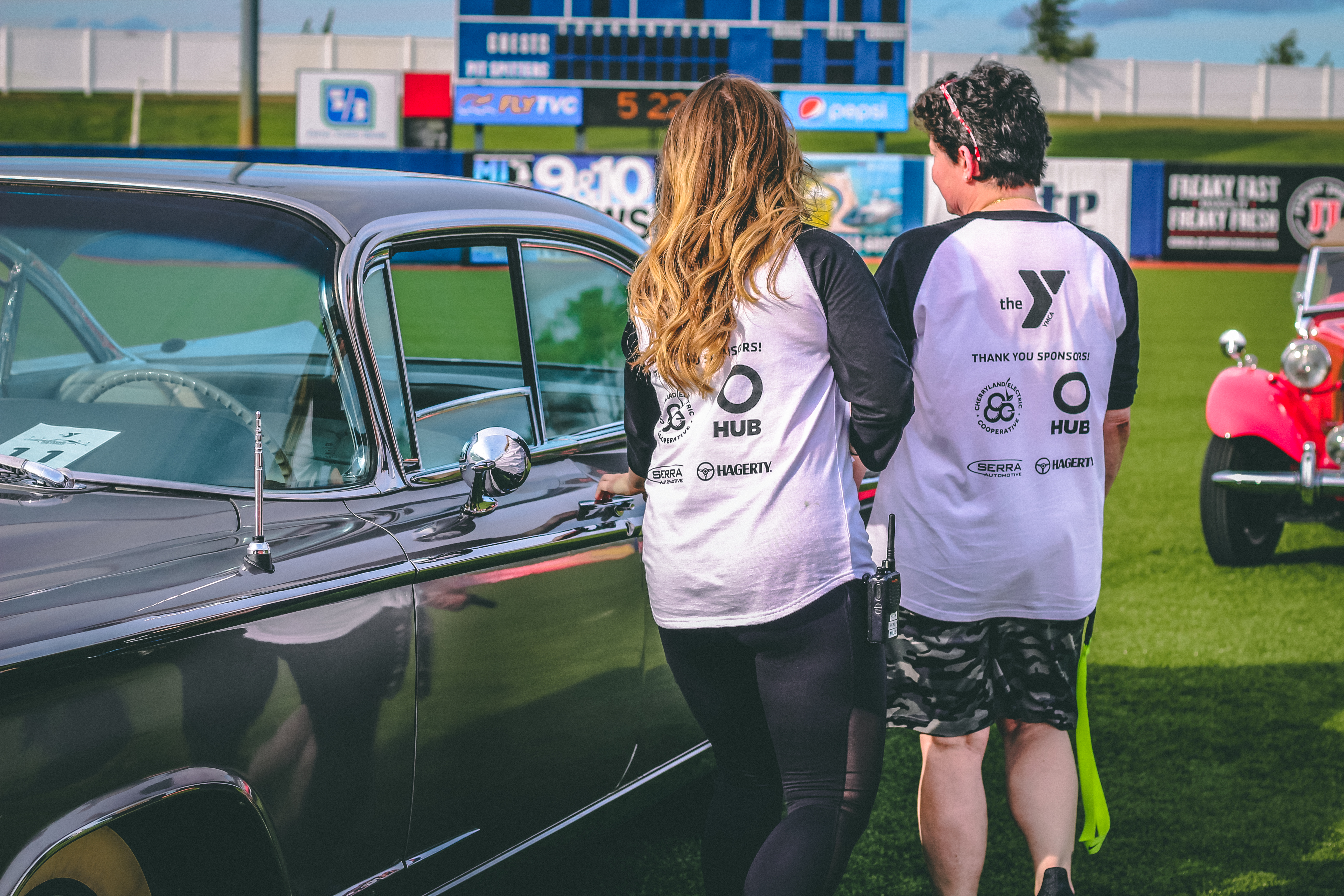 Classic cars on a baseball diamond