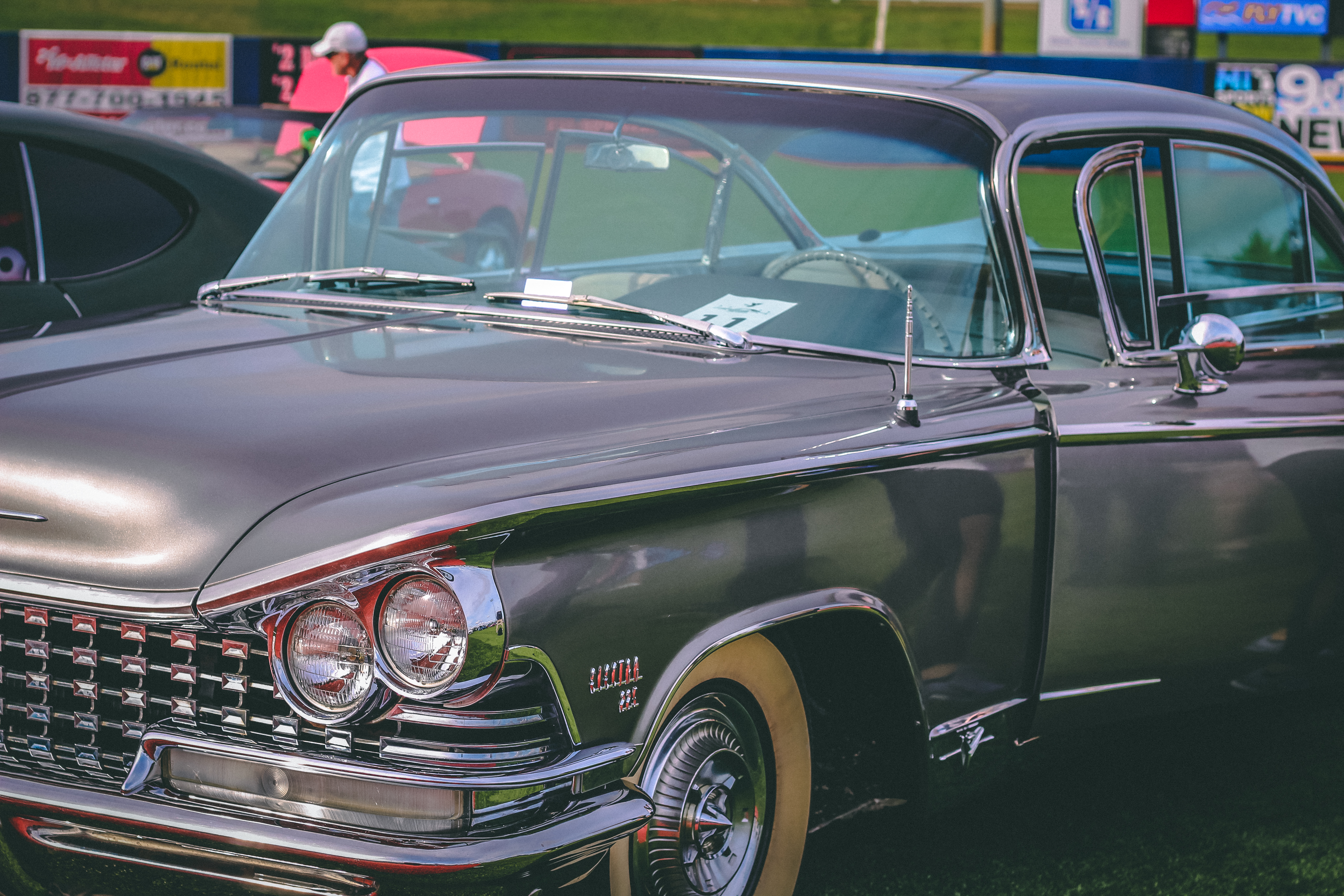 Classic cars on a baseball diamond