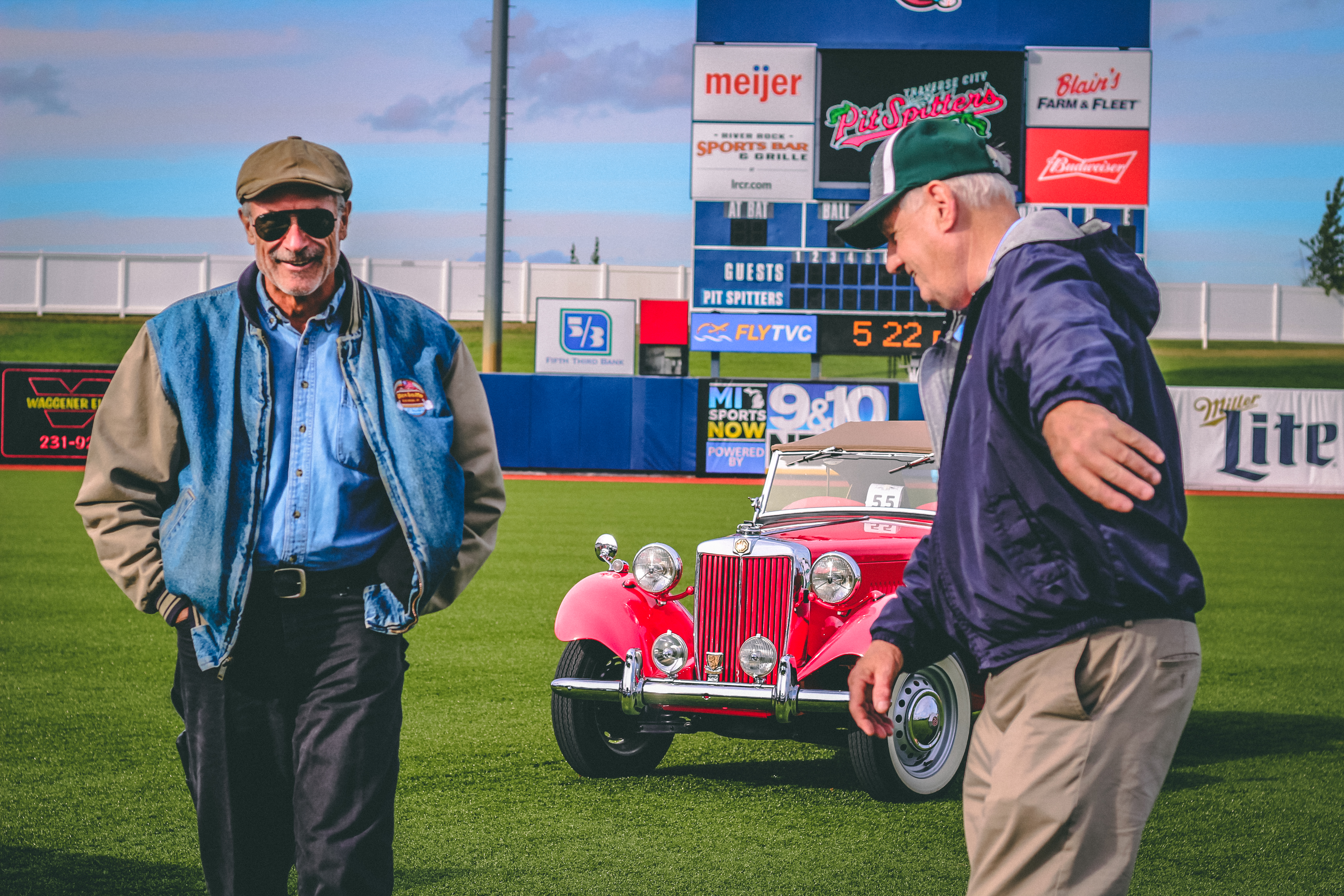 Classic cars on a baseball diamond