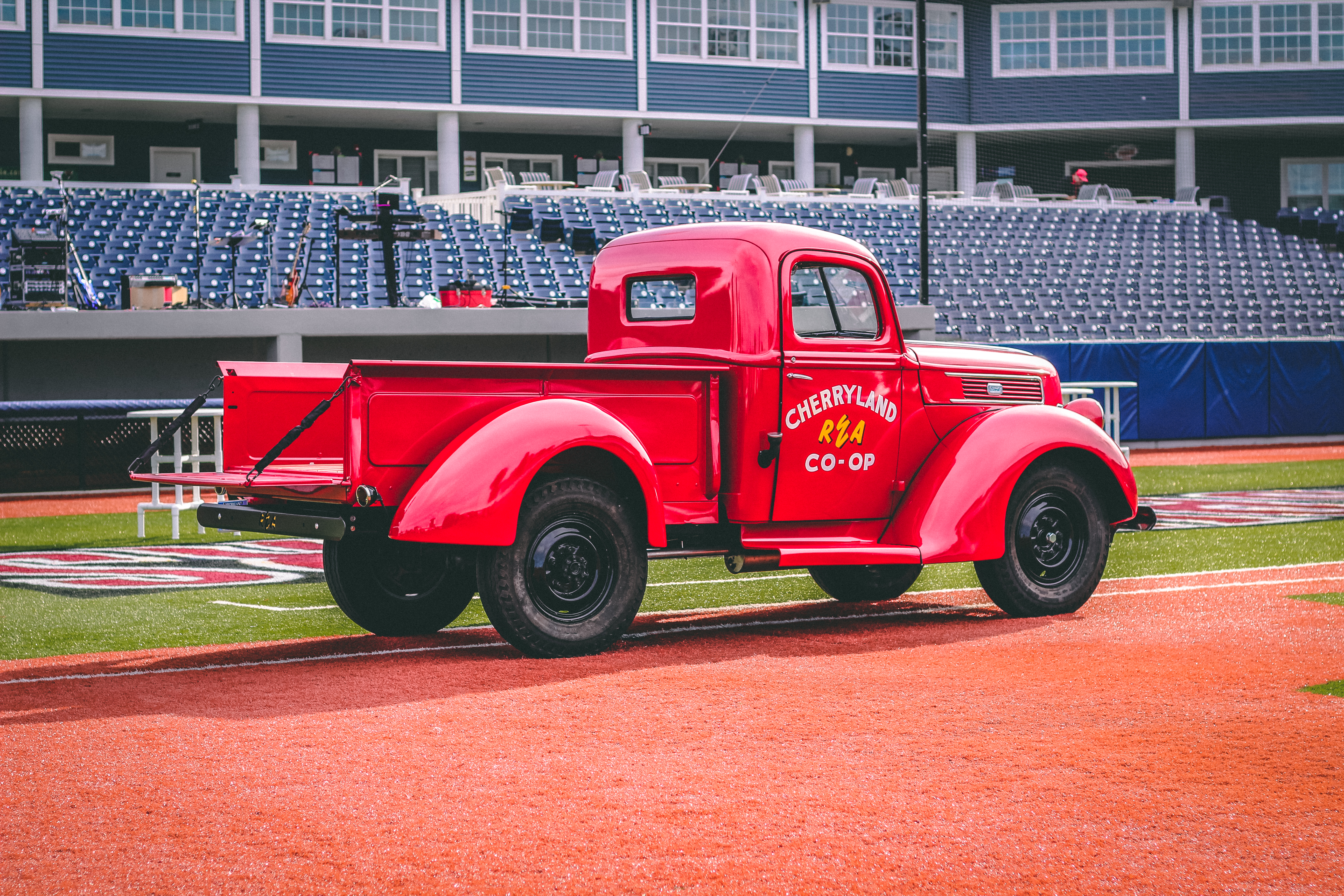 Classic cars on a baseball diamond