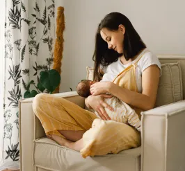 Serene person breastfeeding infant 