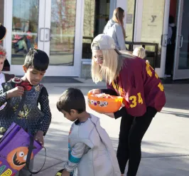 People celebrating halloween outside of West Y