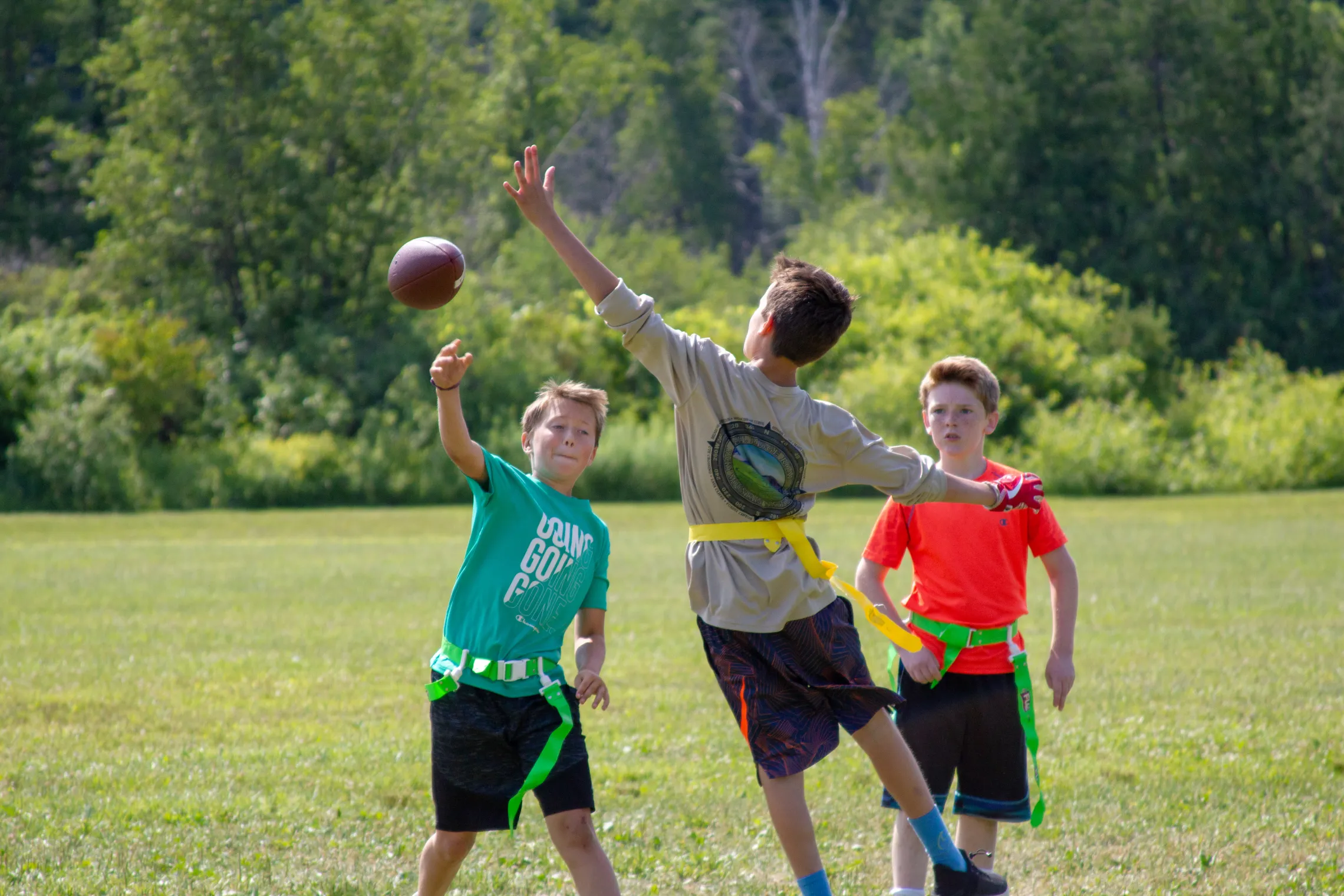 Kids throwing football