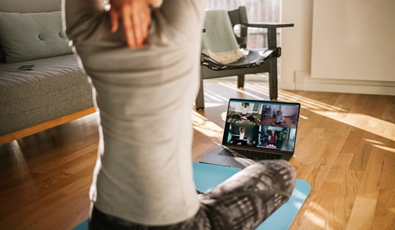 Young woman watching streaming fitness class