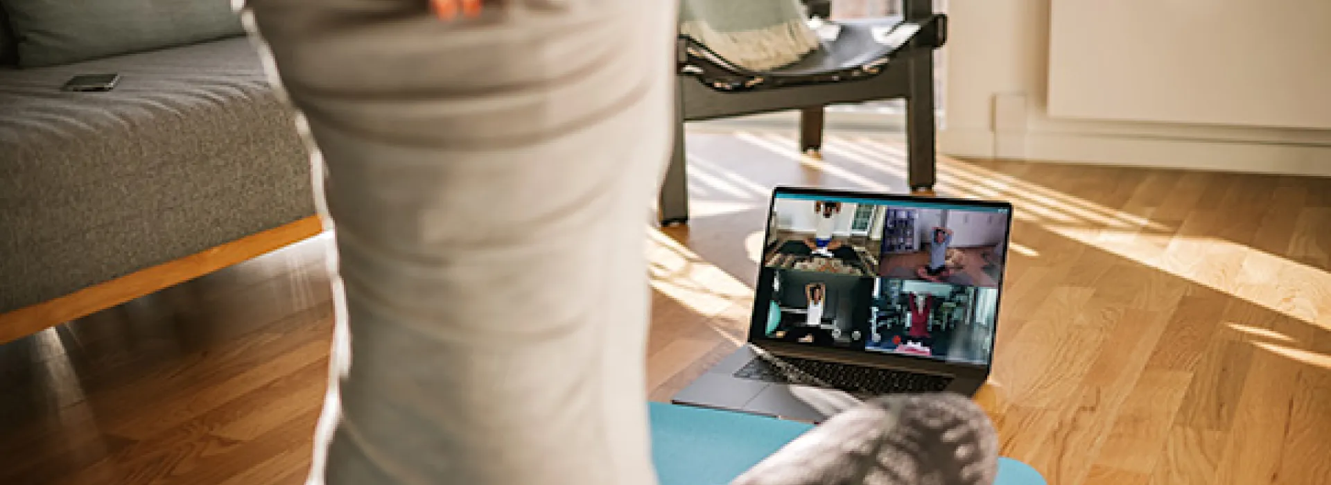 Young woman watching streaming fitness class
