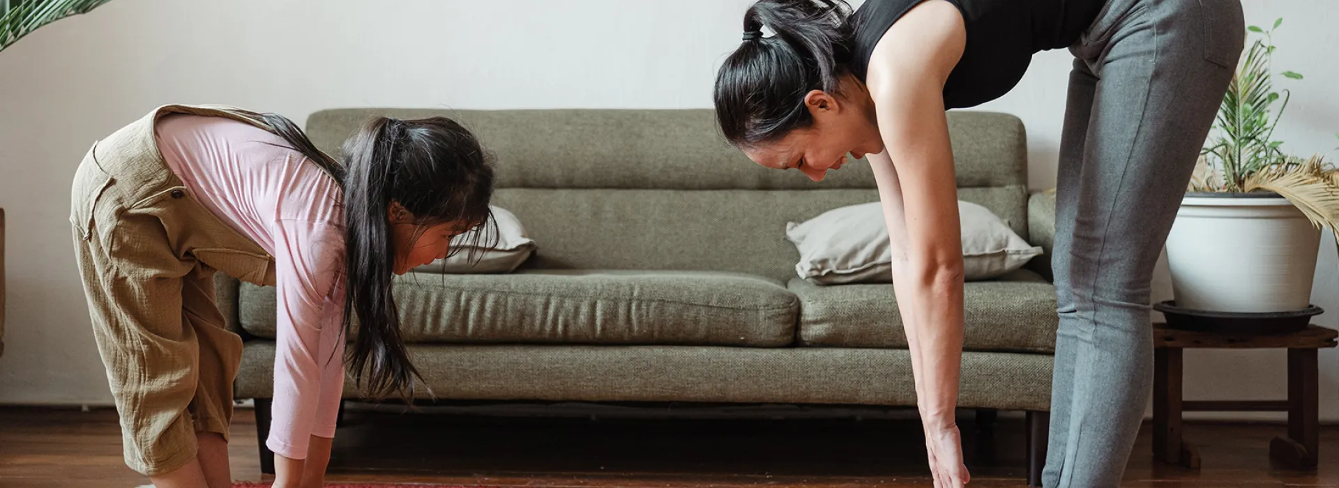 Mom and Daughter stretching at home