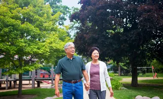 A senior couple walks together