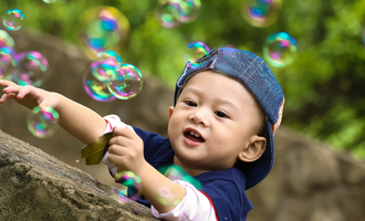 a child plays with bubbles