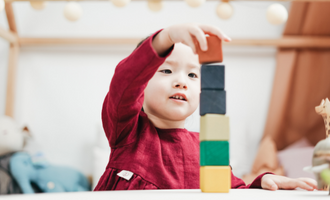a child plays with blocks