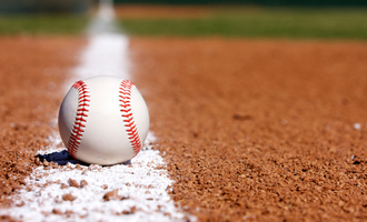 a baseball sits on the ground
