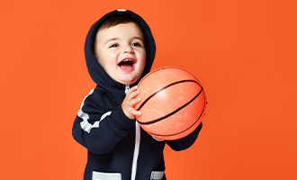 Child holding basketball