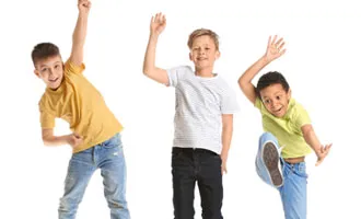 3 Boys jumping with arms rasied