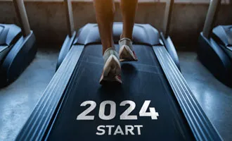 Mans feet running on a treadmill above the words 2024 Start