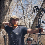 an image of jacob aiming a bow and arrow