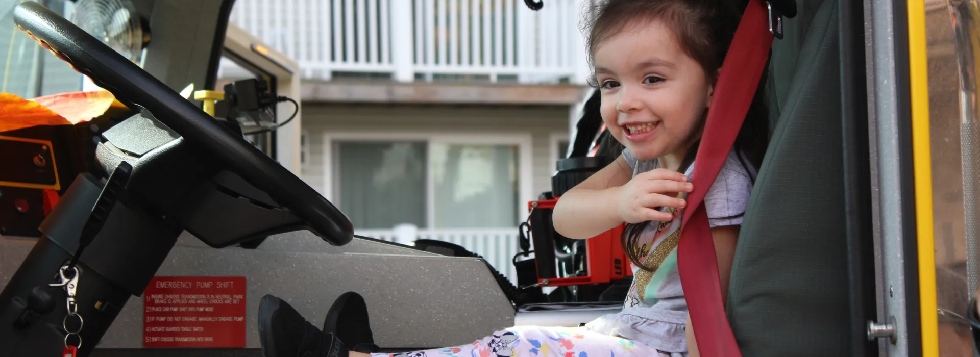 A child sits in a fire truck