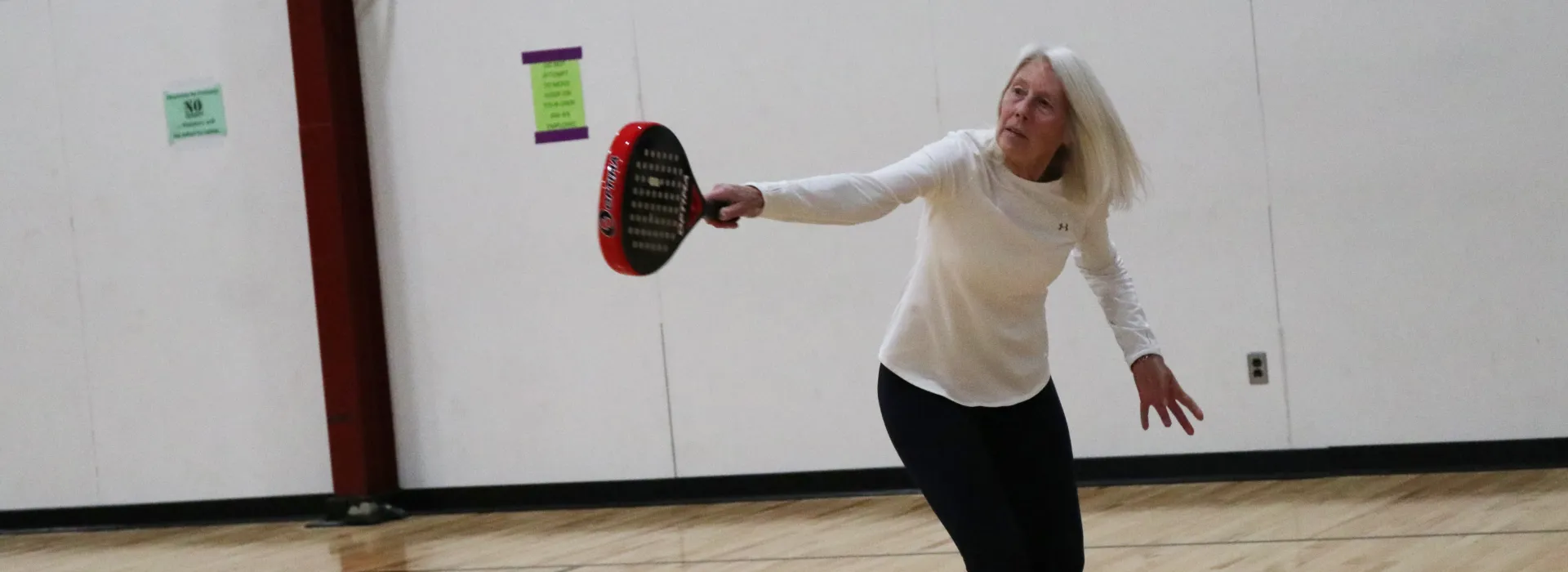 an adult playing pop tennis