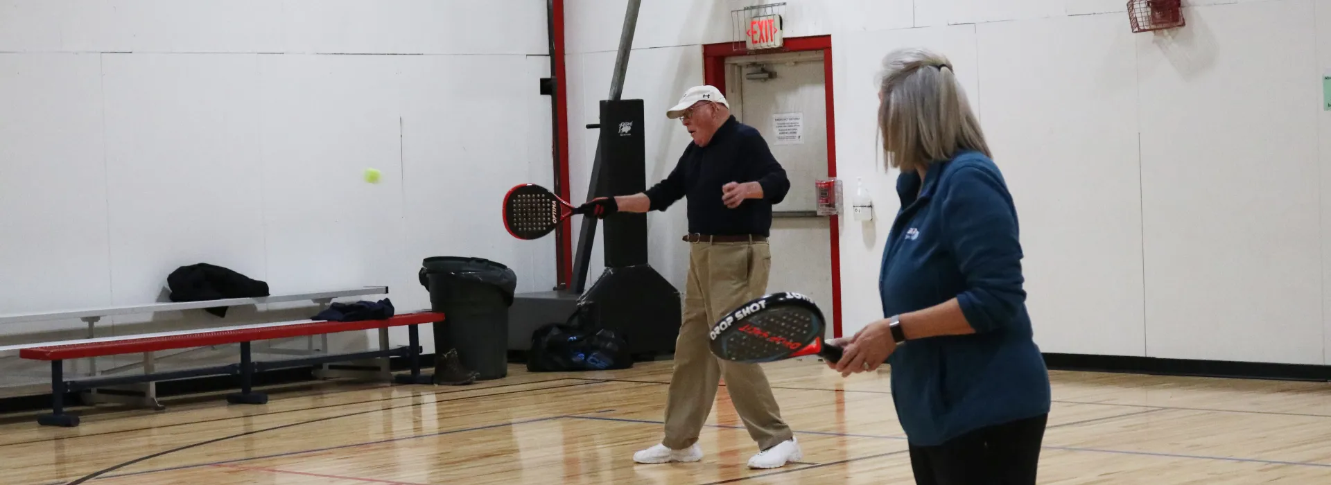 an adult playing pop tennis