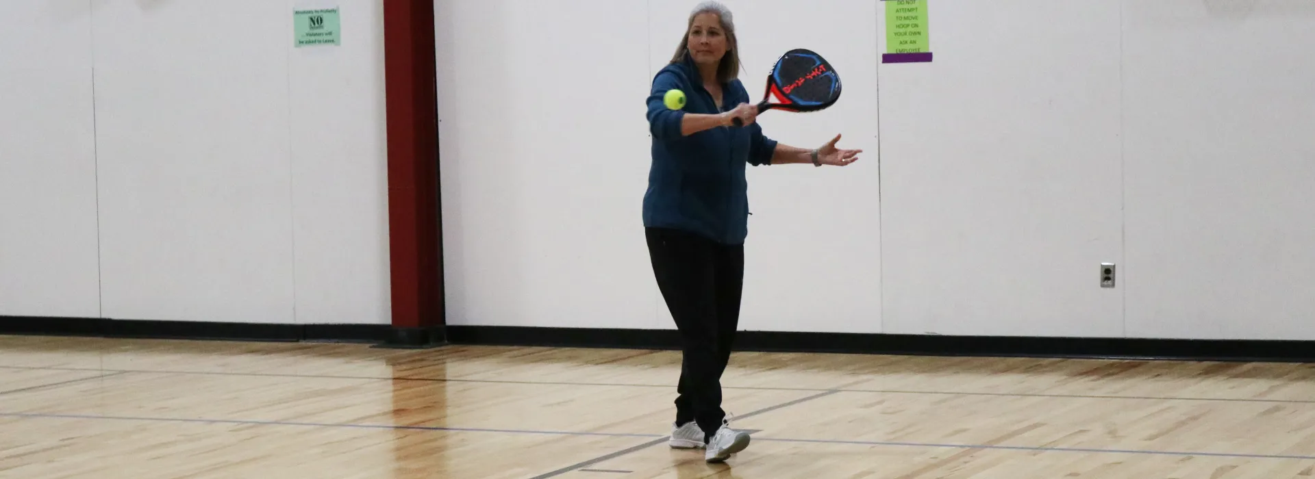 an adult playing pop tennis