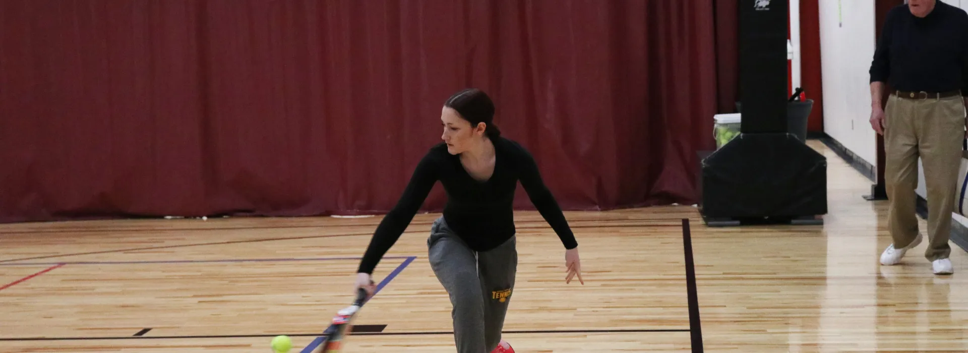 an adult playing pop tennis
