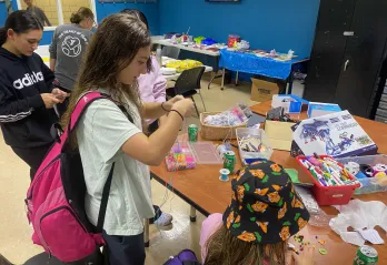 Teens doing arts and crafts at relaunch party in Church St Y