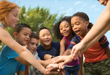 group of kids in a team huddle