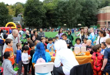 Fall Fest 2023, scientists showing group of kids experiments