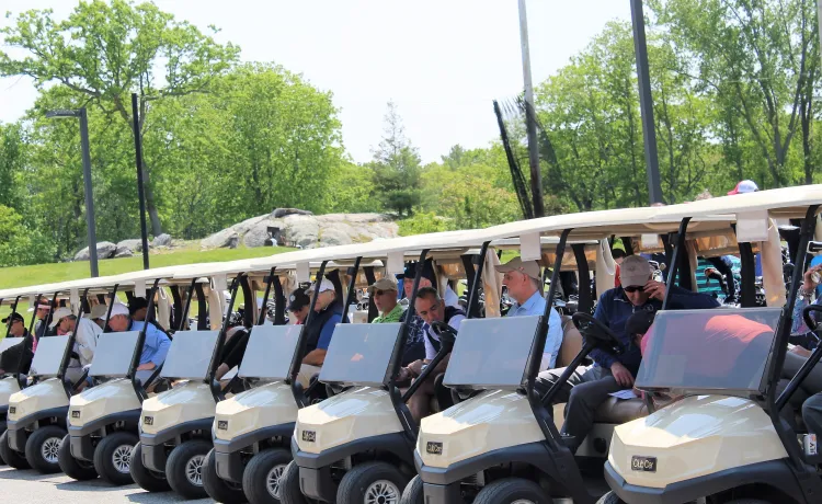 Golfers and carts lined up for the 2023 WSYMCA Annual Golf Tournament