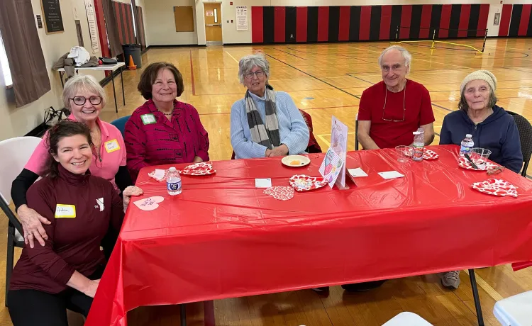 6 people sitting around a table at the Church St Y