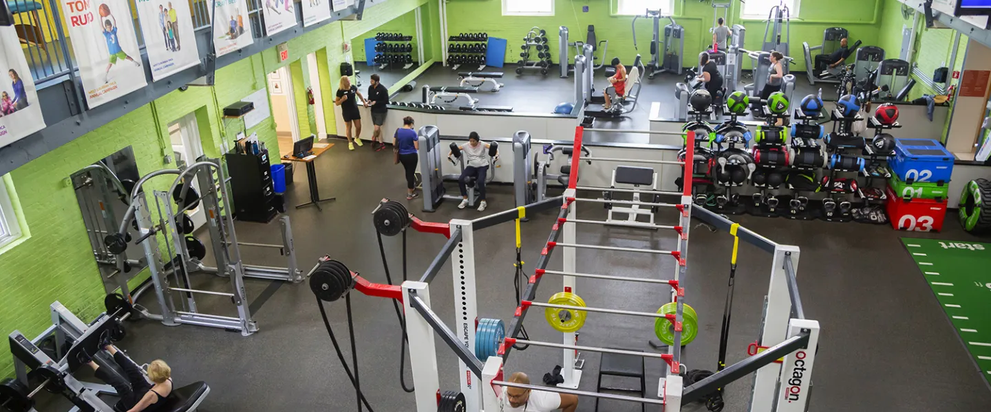A fitness center filled with weights and workout equipment