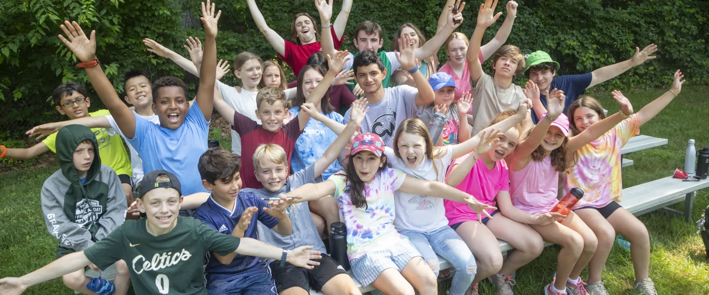 Group of campers posing happily at Camp Frank A Day