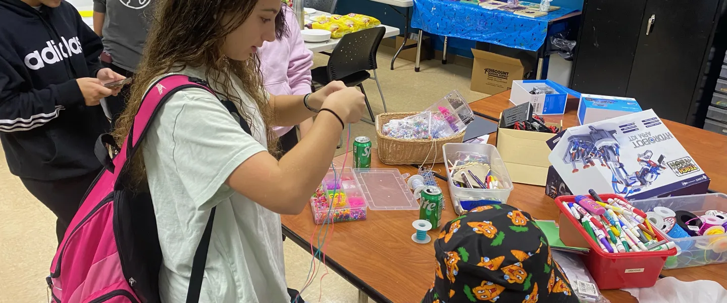 Teens doing arts and crafts at relaunch party in Church St Y