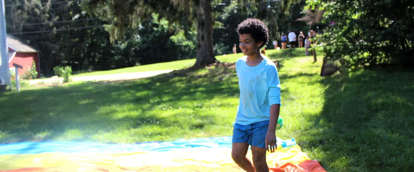 CFAD camper playing with water games