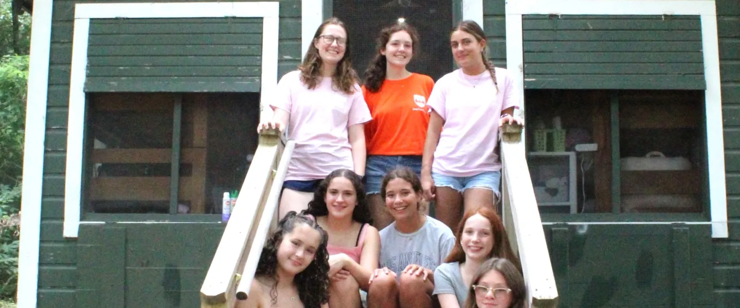 CFAD campers smiling in front of cabin
