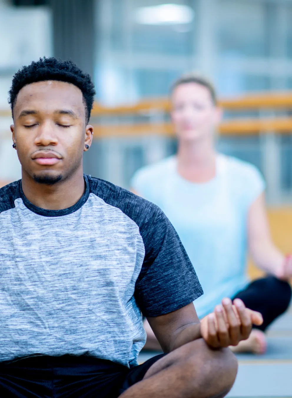 Group of people in mediation class sitting cross legged