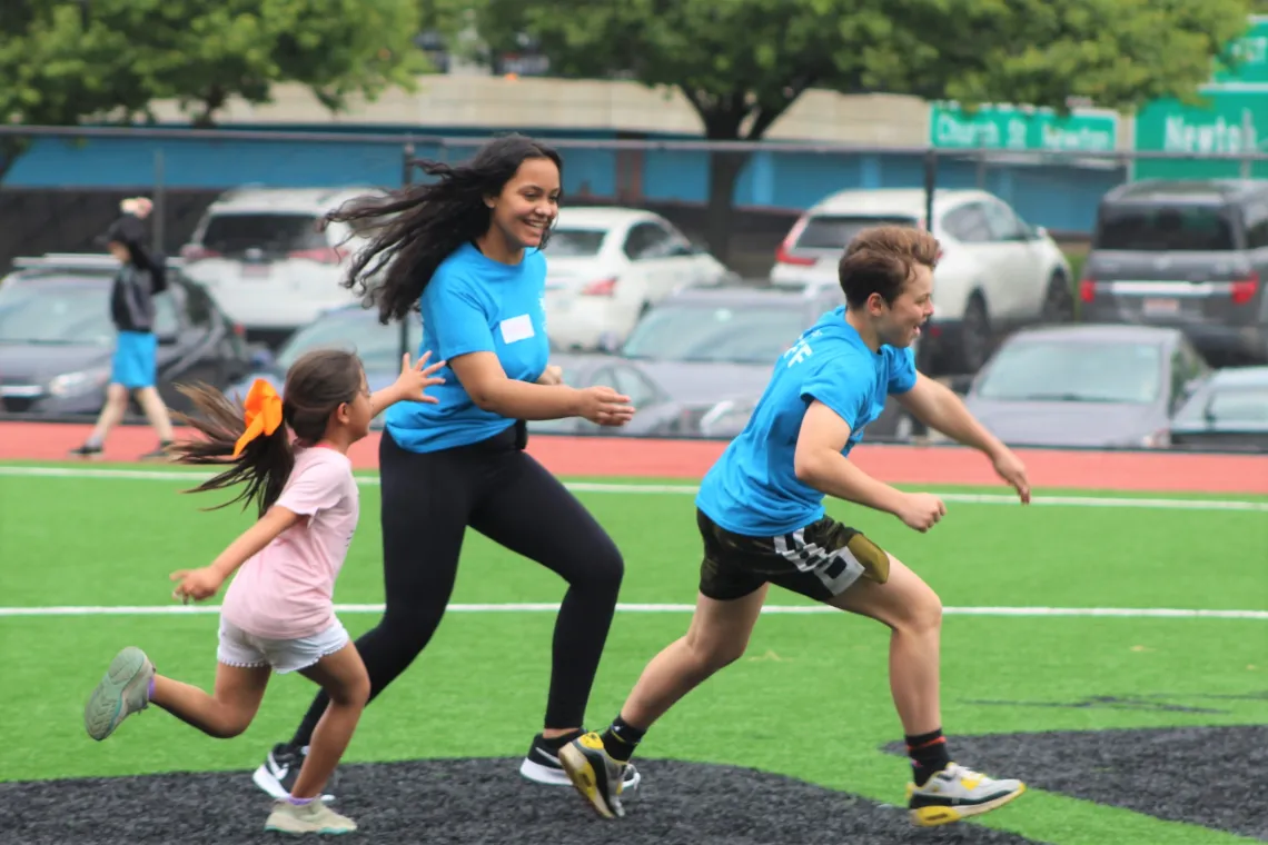 Playing tag with counselors at Camp Pikati